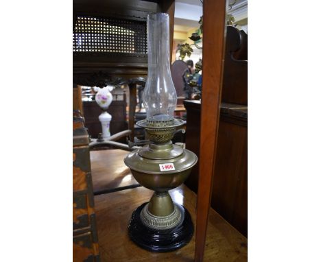 A Victorian brass oil lamp, height excluding chimney 32cm. 
