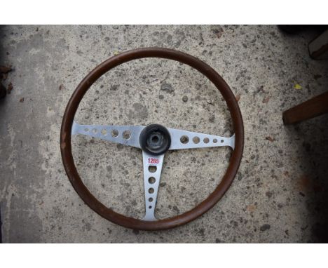 Automobilia: a vintage 15in steering wheel.  Condition Report: No makers mark seen.  Crack to wood in several places.  Some d