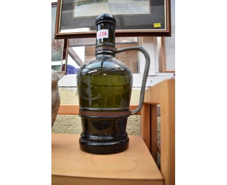 An old green glass bottle form lamp, 32.5cm high.  Condition Report: Some quite deep surface scratching, no cracks.
