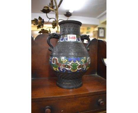 Two Chinese bronze and cloisonne enamel twin handled vases, 24cm high.