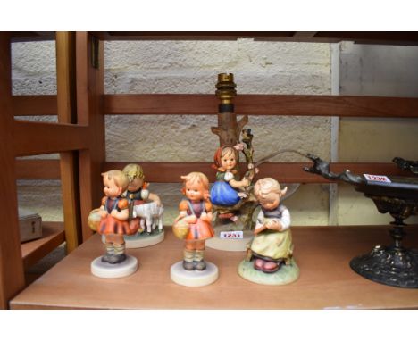 Five Hummel figures, to include a lamp. 