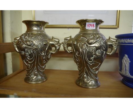 A pair of Chinese bronze twin handled vases, four character seal marks,23.5cm high. 