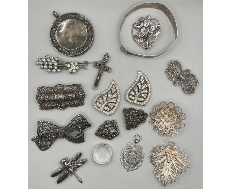 A selection of antique and vintage white metal jewellery comprising three marcasite set brooches; two (odd) marcasite dress c