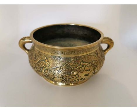A 19th century Bronze two handled censer, casting relief two 5 claw sky dragons chasing pearls.6 character mark Xuande 1426-1
