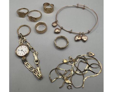 A selection of 9ct gold jewellery comprising six rings (total approximate weight 22.7 grams), a Rotary ladies cocktail watch 