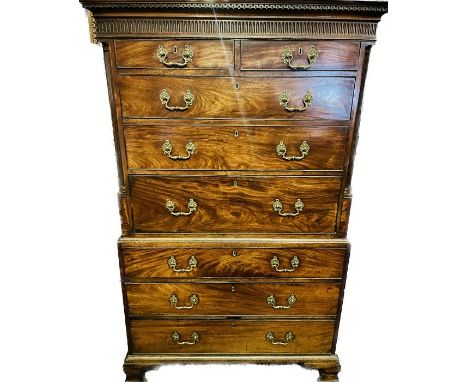 A George III mahogany chest on chest, circa 1790, in the manner of Thomas Chippendale, moulded dental cornice on inverted arc