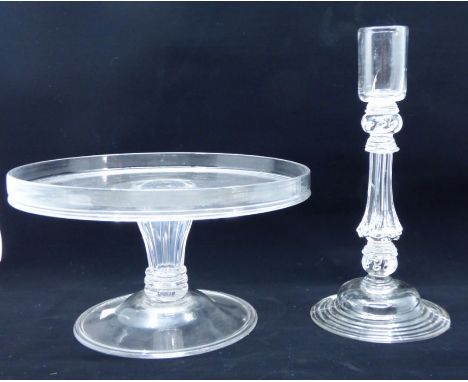 A late 18th/early 19th glass candlestick with plain sconce above moulded wrythen stem and stepped circular domed base, 25cm h