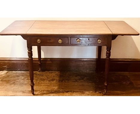 A late Regency mahogany pembroke or sofa table, circa 1820, rectangular shaped flanked by curved corner drop-leaves, above tw