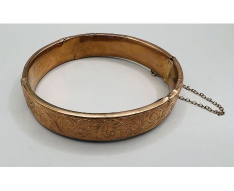 A 9ct gold hinged bangle (as found). Approximate weight 12.5 grams. (1)