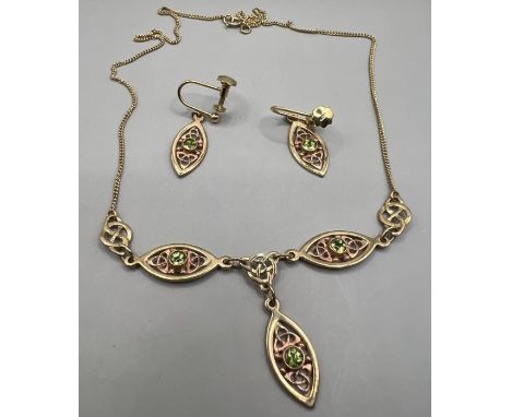 A vintage Clogau gold suite of 9ct gold Celtic design jewellery, set with green stones, comprising a necklace and screwback e