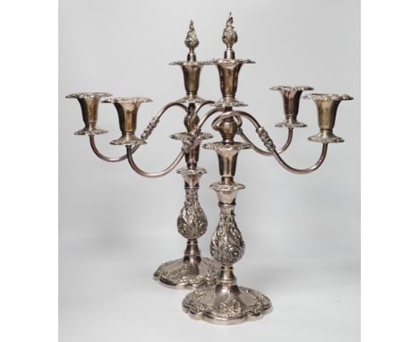 Two silver plated two branch three light candelabra, 49cm high***CONDITION REPORT***PLEASE NOTE:- Prospective buyers are stro