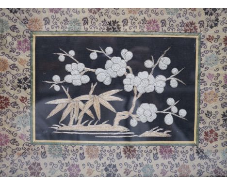 Three framed Chinese silk embroidered panels including a Beijing knot embroidered panel, two with applied butterflies, larges