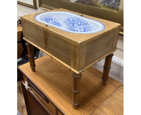 A 19th century French faux bamboo rectangular bidet with blue and white ceramic liner, width 52cm, depth 36cm, height 42cm***