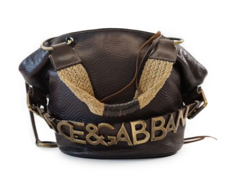 A Dolce &amp; Gabbana brown and black leather bucket bag, two plaited fabric and leather handles with leopard print lining, b