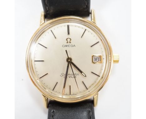 A gentleman's yellow metal Omega Seamaster De Ville manual wind wrist watch, on associated leather strap, case diameter 34mm,