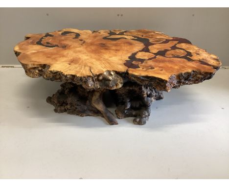 An American redwood and coloured resin trunk section coffee table circa 1970, width 130cm, depth 90cm, height 37cm***CONDITIO