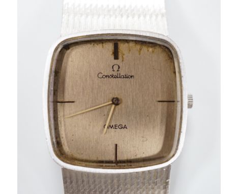 A gentleman's 1970's 750 white metal Omega Constellation manual wind dress wrist watch, on integral 750 Omega bracelet, movem