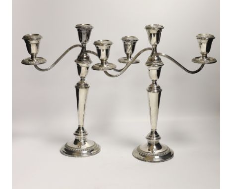 A pair of 20th century Alvin sterling three light, two branch candelabra, height 32.1cm, weighted, arms weight 220z.***CONDIT