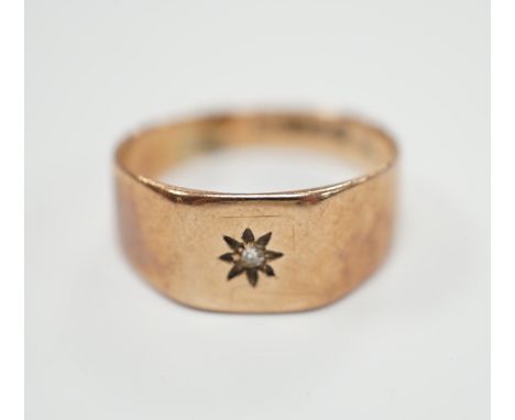 A 9ct gold and diamond chip set signet ring, size R, gross weight 3.7 grams.***CONDITION REPORT***PLEASE NOTE:- Prospective b