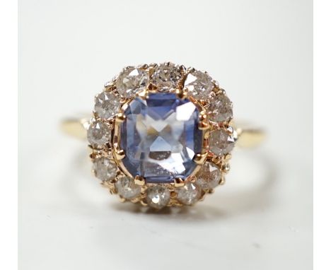 An 18ct, sapphire and diamond set cluster ring, size M, gross weight 3 grams.***CONDITION REPORT***PLEASE NOTE:- Prospective 