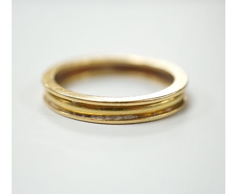 A modern Theo Fennel 18ct gold band, size R, gross weight 4.8 grams.***CONDITION REPORT***PLEASE NOTE:- Prospective buyers ar