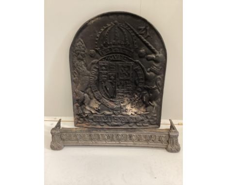 A Victorian cast iron Royal Coat of Arms fireback, width 54cm, height 68cm together with a small Victorian cast iron fender**