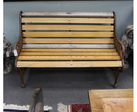 A Victorian Coalbrookdale passion flower pattern cast iron garden bench restored with later ash slats, length 129cm, depth 64
