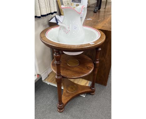 A Victorian circular mahogany three tier washstand with ceramic jug and basin, diameter 55cm, height 76cm***CONDITION REPORT*