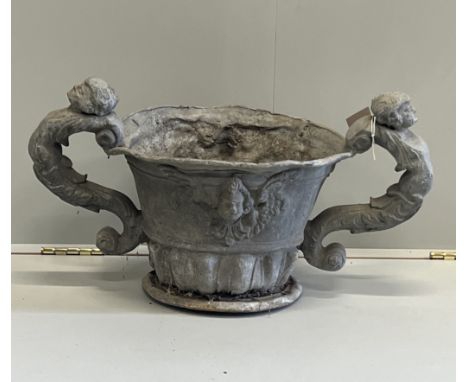 A Victorian lead twin handled urn, width 63cm, height 36cm***CONDITION REPORT***PLEASE NOTE:- Prospective buyers are strongly