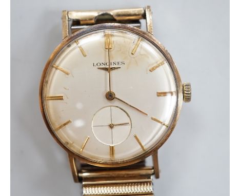 A gentleman's 9ct. gold Longines manual wind wrist watch, with engraved inscription, on an associated strap, boxed.***CONDITI