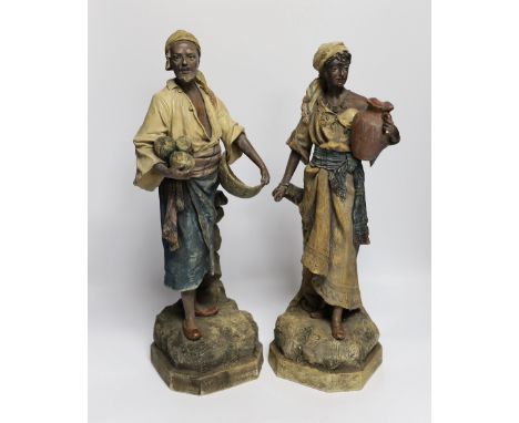 A pair of Goldscheider type Nubian figures, tallest 46cm***CONDITION REPORT***PLEASE NOTE:- Prospective buyers are strongly a