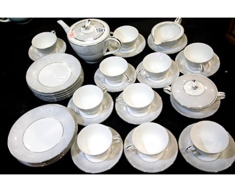 Noritake 33 piece tea set in Damask pattern, tea pot, milk jug, sugar bowl with 10 cups, saucers and side plates. Looks unuse