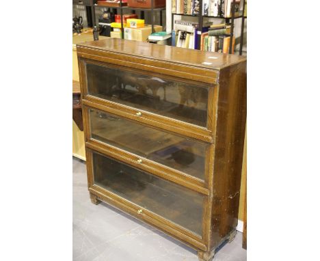 Three shelf Globe Wernicke type bookcase in walnut, 90 x 30 x 100 cm H. Not available for in-house P&P.Condition Report: No a