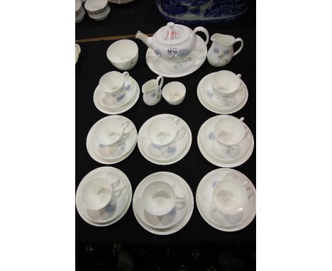 Wedgwood Ice Rose design tea service, an eight place setting comprising cups, saucers and side plates, teapot, two sugar bowl