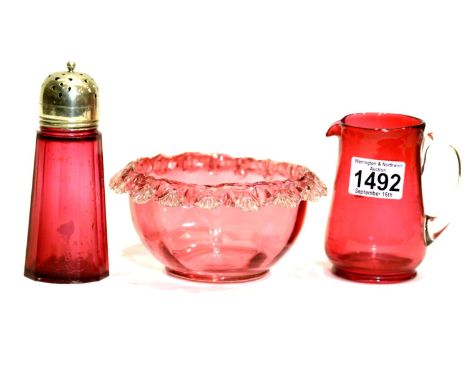 Cranberry glass sugar bowl and milk jug and a cranberry glass sugar castor. P&amp;P Group 3 (£25+VAT for the first lot and £5