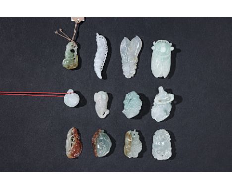 A GROUP OF 12 ASSORTED SMALL JADE CARVINGS
Including a model of a toad; a buffalo; a snail; a cicada; peas; bats on a peach e