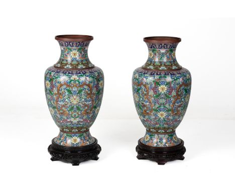 A PAIR OF VERY LARGE CLOISONNE ENAMEL VASES
20th Century, with an elaborate design of dragons amongst scrolling lotus , on a 