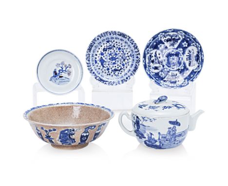 A GROUP OF BLUE AND WHITE CERAMICS Comprising: a shallow teapot, decorated with figures in a landscape, the cover with Buddhi