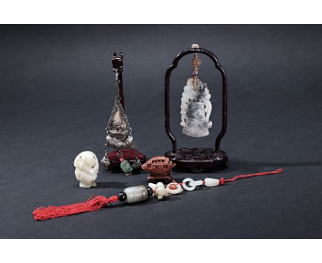 A GROUP OF SMALL CHINESE COLLECTIBLES
Comprising: a jade figural carving; a tassel comprising various jade sections; a white 