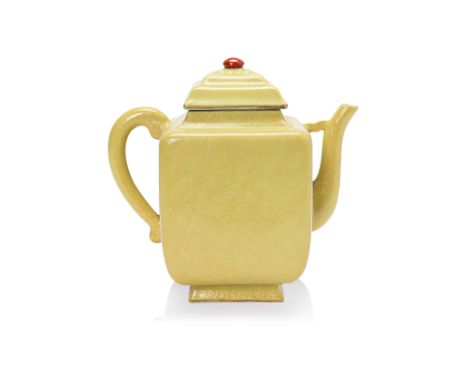 A YELLOW GROUND SGRAFFITO PORCELAIN TEAPOT Square section with scroll handle, blue glazed base with apocryphal Qianlong mark,