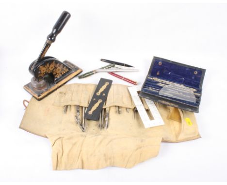 A set of Stanley drawing instruments, in folding case, a similar collection in leather roll, a mother-of-pearl handled penkni