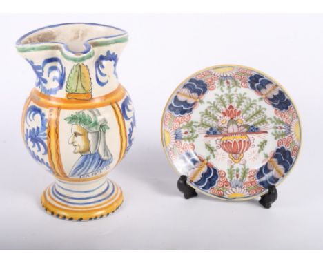 A Makkum faience saucer with traditional decoration, 6 1/2" dia, and an Italian majolica jug with Dante portrait decoration, 