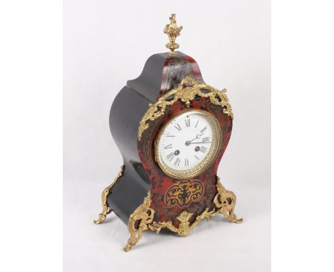 A tortoiseshell and brass boulle work mantel clock of Louis XVI design, eight-day striking movement, 14 1/2" high