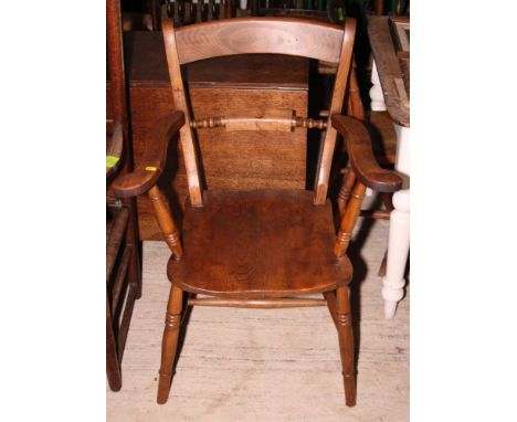 A 19th Century Oxford bar back elbow chair with panel seat, on turned and stretchered supports