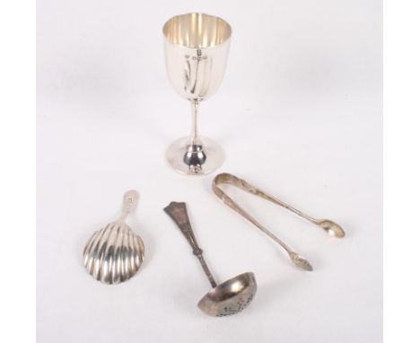 A silver goblet, 2.3oz troy approx, a Georgian silver caddy spoon with shell-shaped bowl, .34oz troy approx, a pair of silver