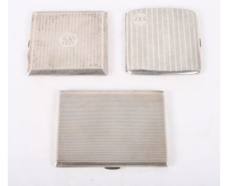 Three engine turned silver cigarette cases, 13.4oz troy approx