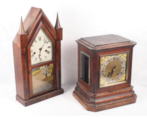 A 19th Century oak cased mantel clock with brass dial and eight-day striking movement, 13 1/2" high, and an American mahogany