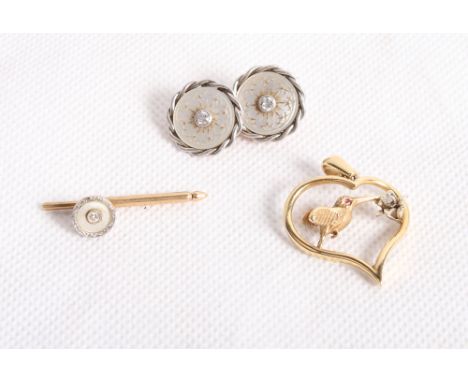 A 14ct gold, diamond and mother-of-pearl cufflink, a matching dress stud and an 18ct gold heart-shaped pendant with diamond a