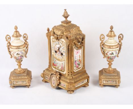 A late 19th Century French gilt metal and porcelain panel clock three-piece garniture with bird and floral decoration, clock 