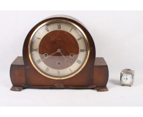 A 1930s oak cased mantel clock and a white metal cased travel alarm clock